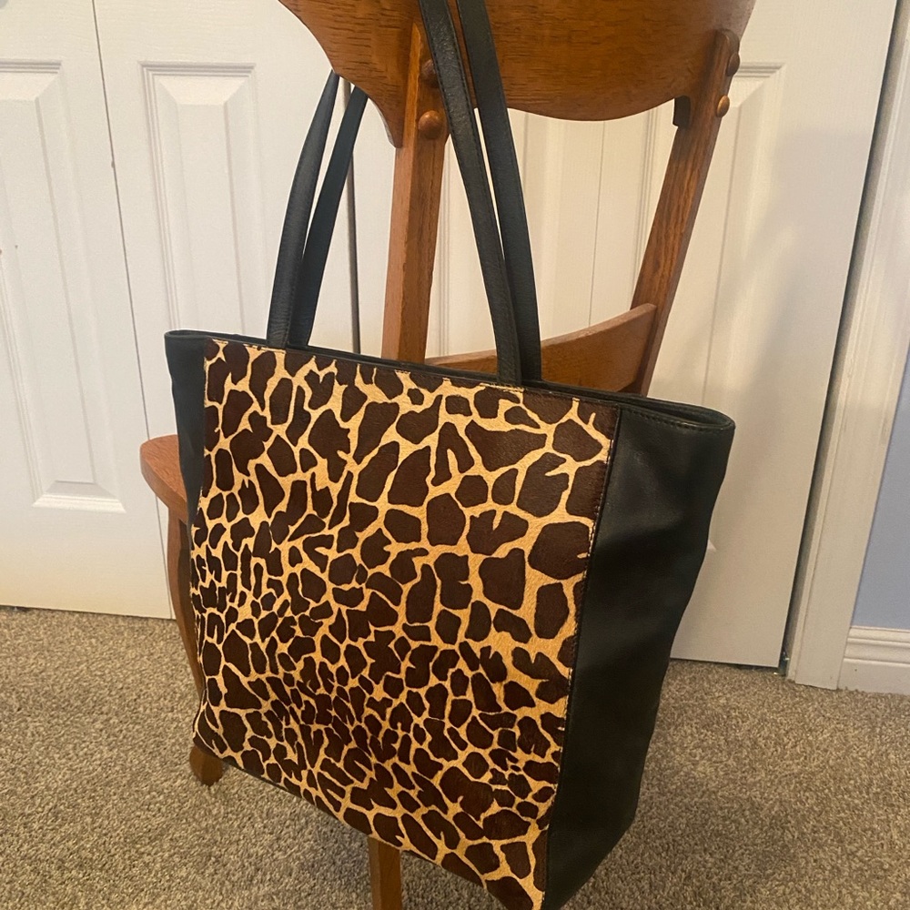 Leather and giraffe print hair hide tote bag
